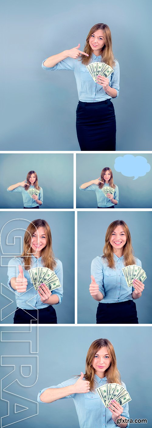Stock Photos - Happy young business woman with gesture. Beautiful smiling business woman standing against blue background. Woman holding a hundred dollar bills USA